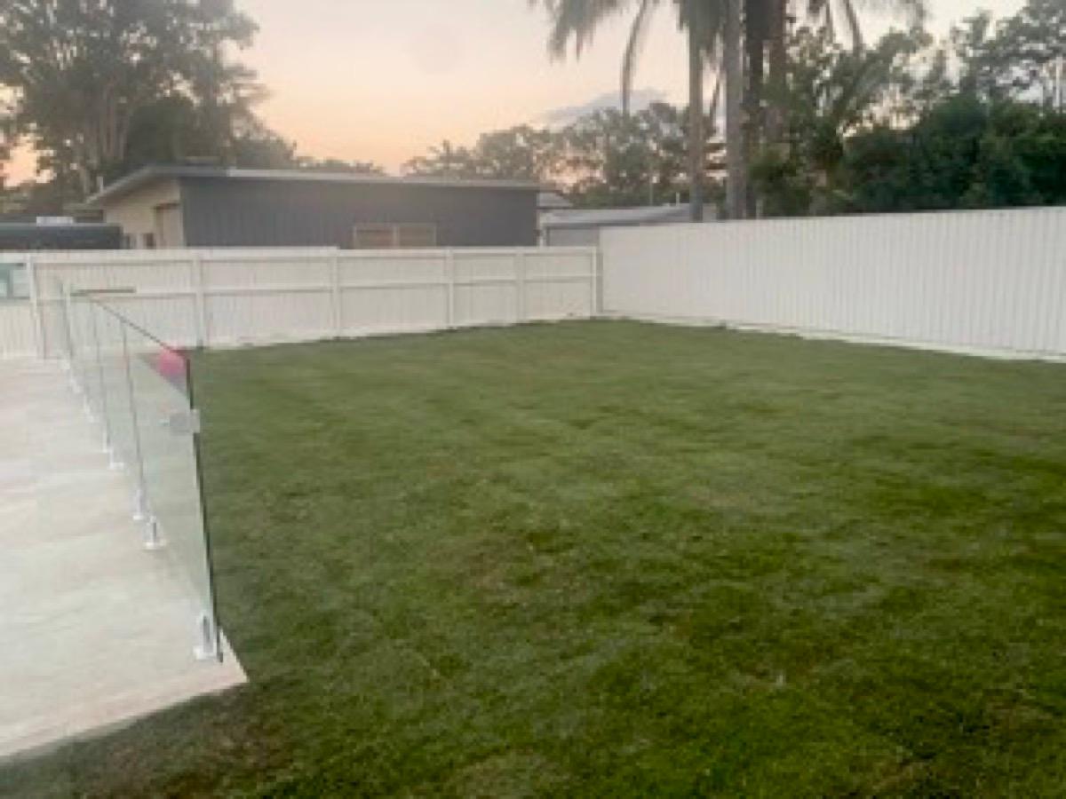 Large backyard lawn at dusk